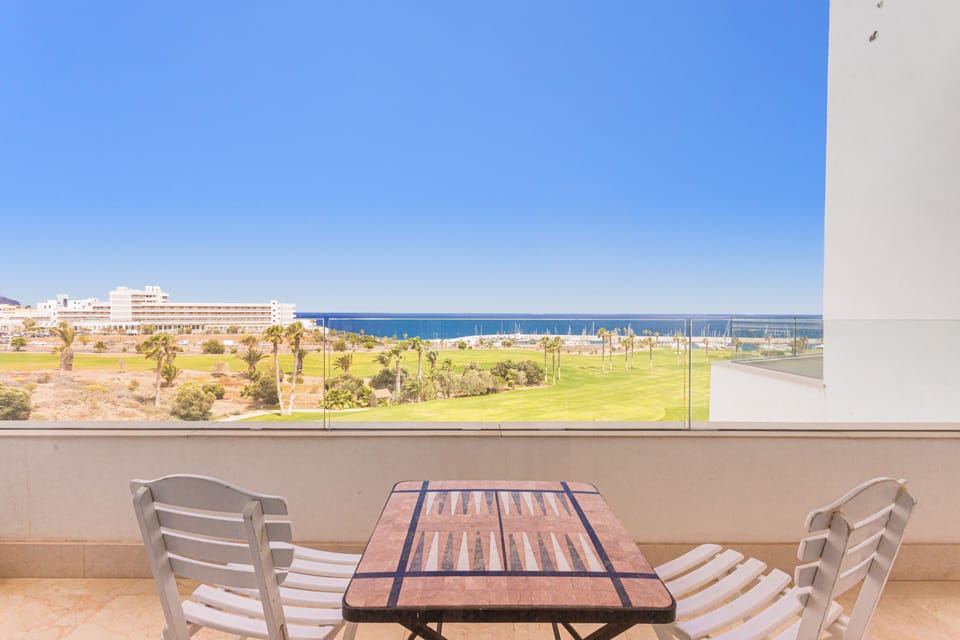 Main bedroom's little terrace view over the golf field and ocean