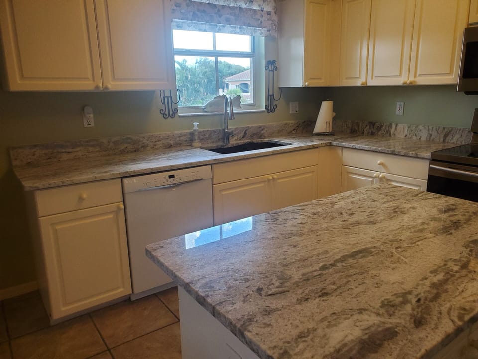 Island with granite and new faucet with black sink