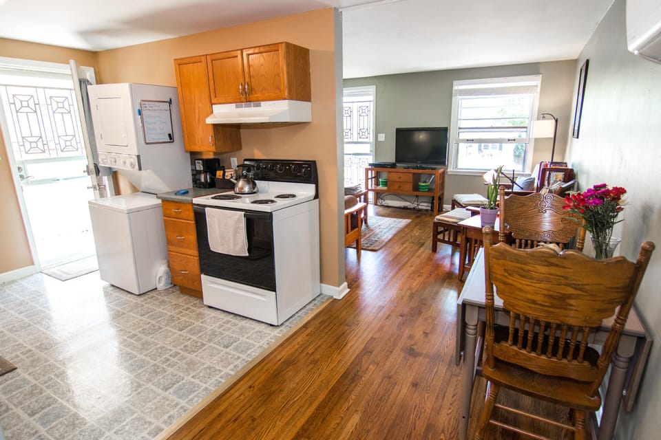 View from hallway showing layout of kitchen and dining table to living room