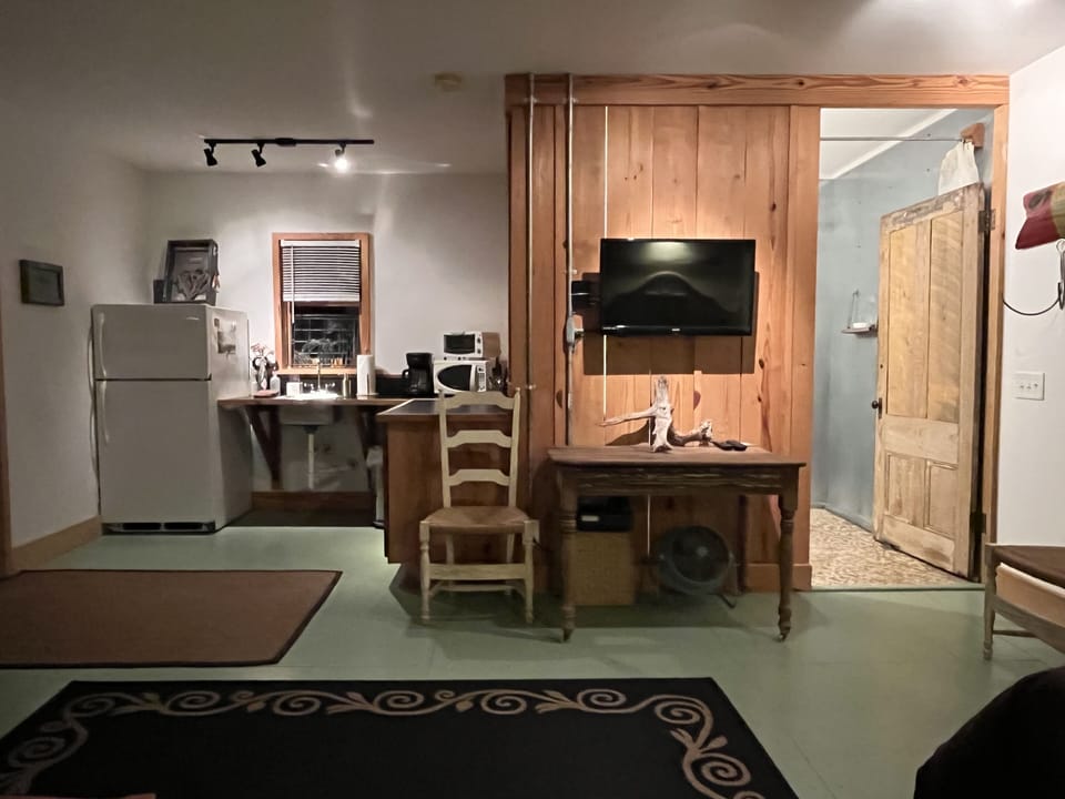 Kitchenette, Dining Table and Bathroom Entry.
