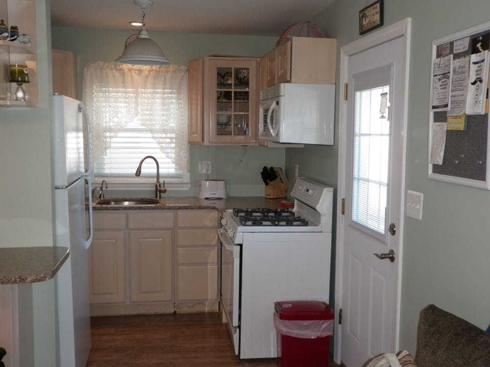 Kitchen, with side door which leads to barbeque 