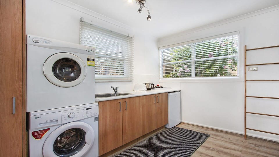 Bay Cottage | Kitchenette in cabin | Bar fridge | Clothes dryer, Washing machine