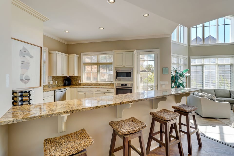 Four counter stools looking in toward the kitchen
