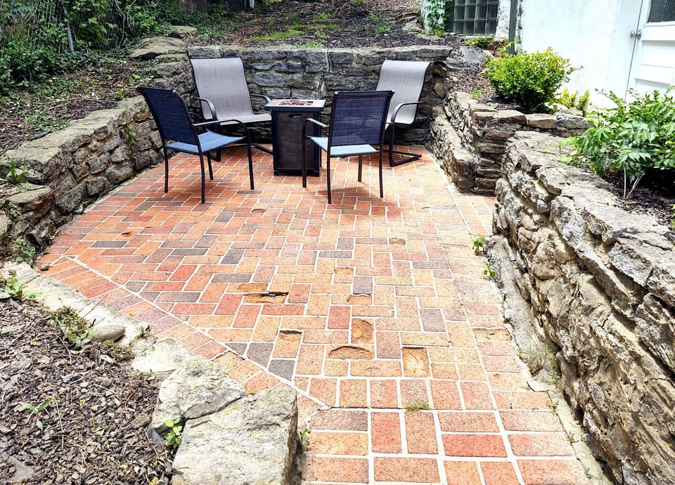 Cozy side patio with fire pit.