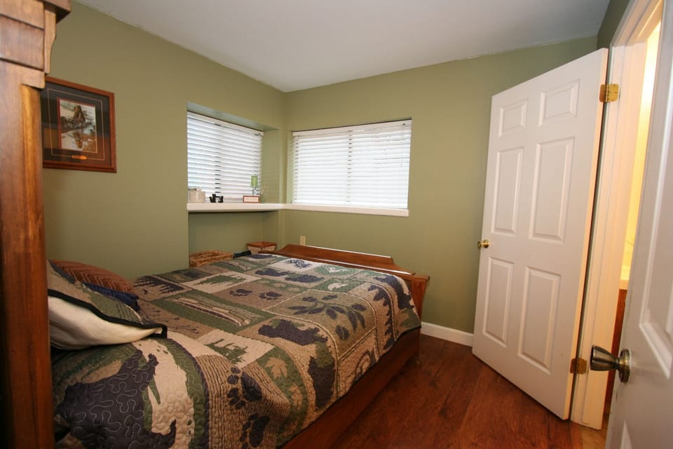 Apartment bedroom with attached bathroom. Queen bed.