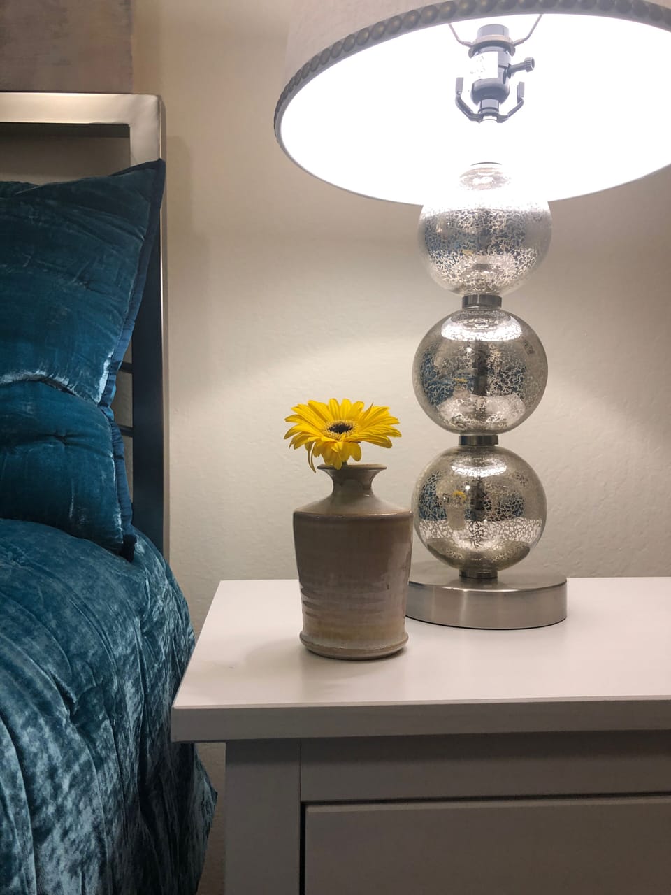 Bedroom with queen bed and 2 sides with lamps. 