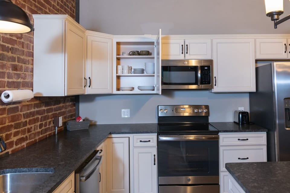 Kitchen with granite countertops & stainless steel appliances