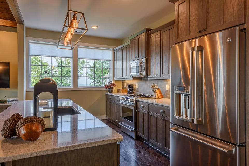 Top of the Line Stainless Appliances with Ice and Water Dispenser on Fridge