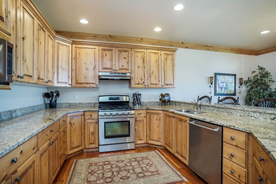 Fully stocked kitchen with appliances, cookware, general spices