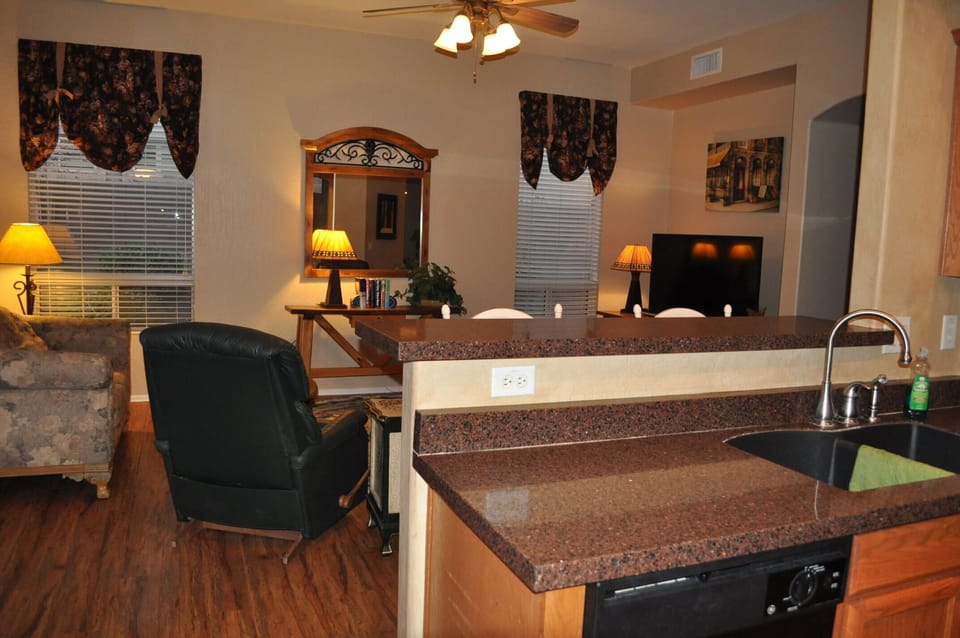 Kitchen with granite high bar, /family room 50"TV, 2 recliners, love seat sofa  