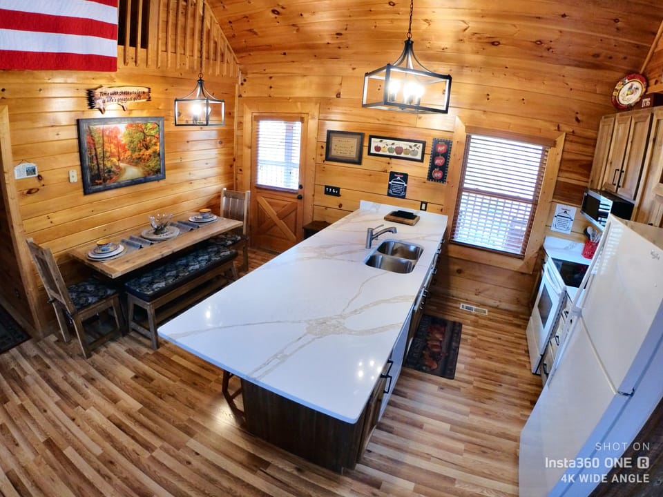 Newly remodeled kitchen, extended countertop, microwave, cabinets.