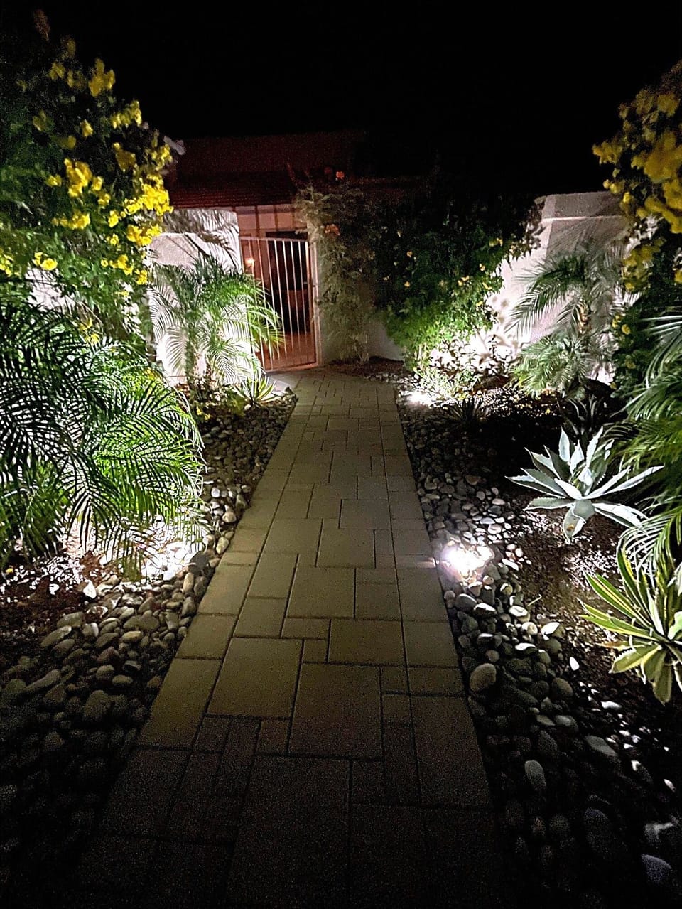 The path leading up to the condo is well lit and nicely landscaped.