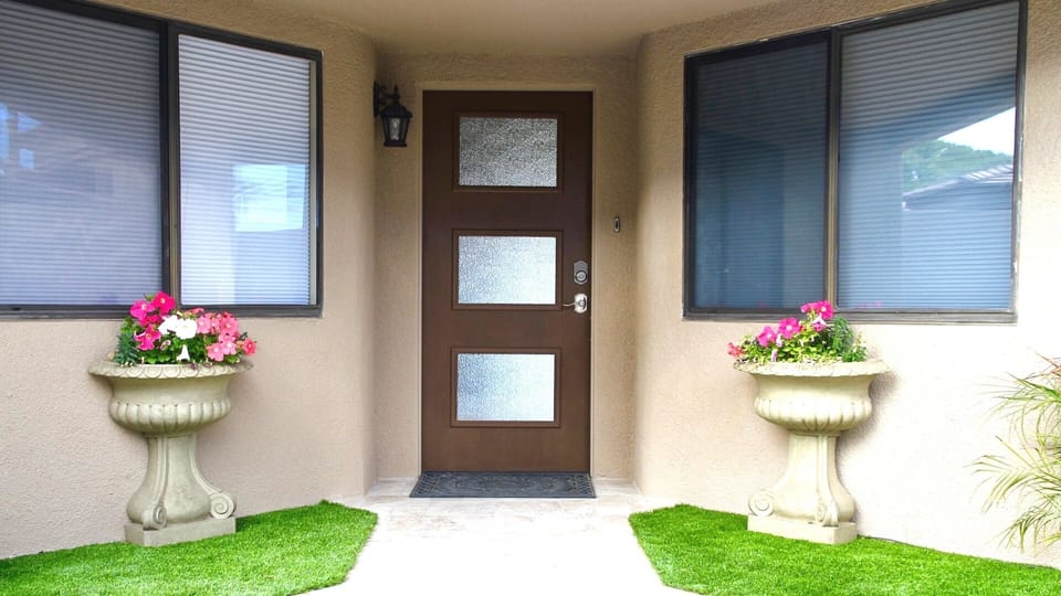 Well manicured private front patio lead you to your front door.