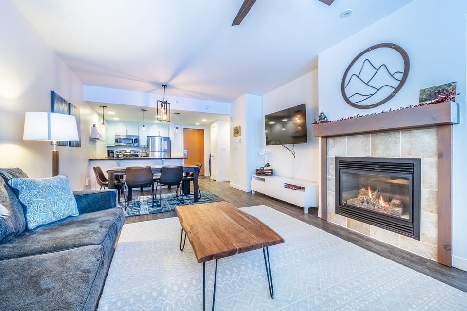 Living area - Gas fireplace, queen size sofa sleeper, access to private balcony, and newly upgraded 55" smart TV.