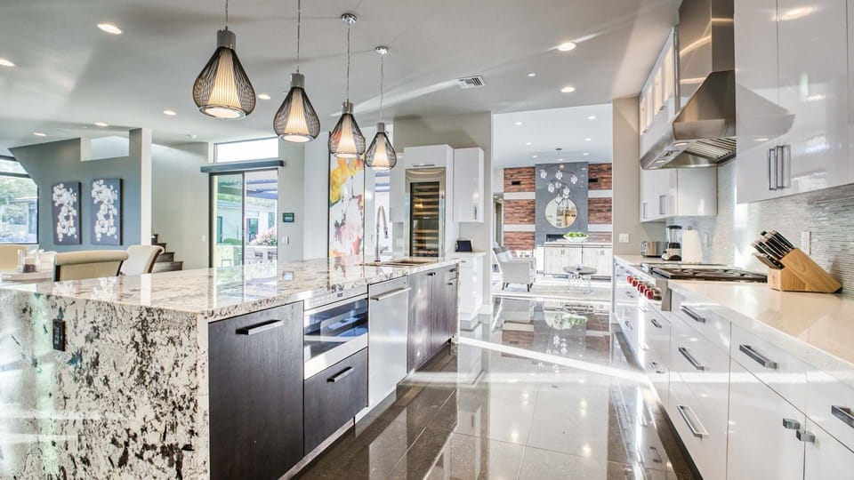 Modern kitchen located off the between the formal living room & TV room 