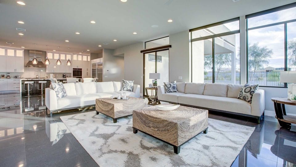 Large comfy couches in the TV room w/ natural lighting off the kitchen 