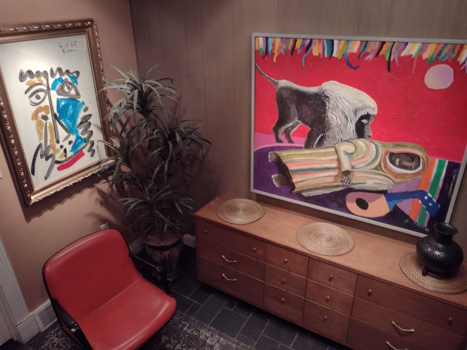 An eclectic collage of furnishings & artwork best describes our interior design.