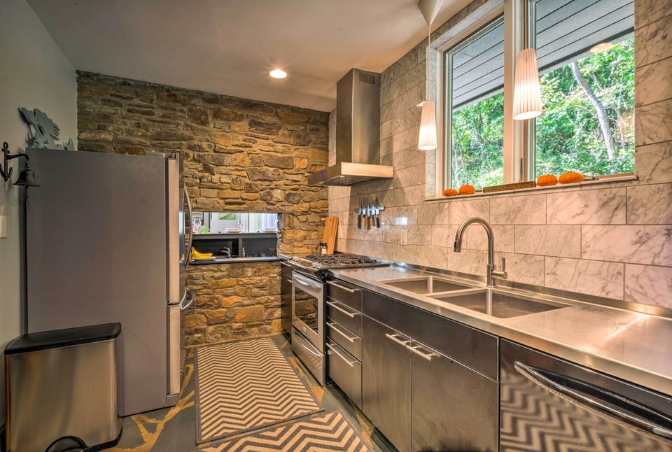 The kitchen is decked out with stainless steel appliances.