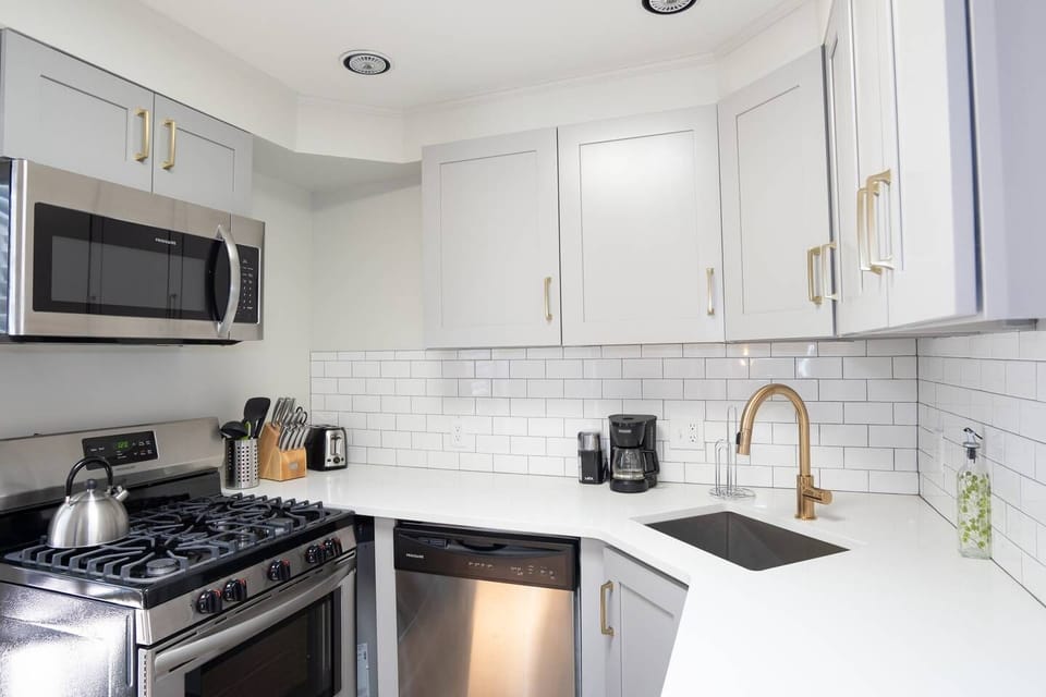 The kitchen is fully stoked with every utensil and appliance one would need to make a home cooked meal.