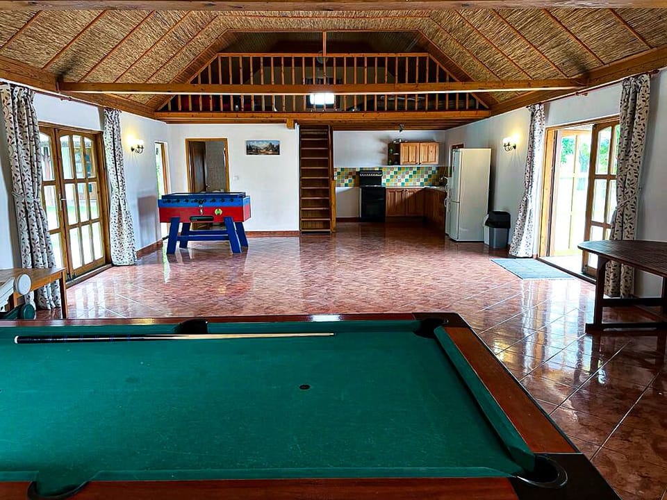 Pool house with kitchen, toilet with shower, staircase to mezzanine floor 