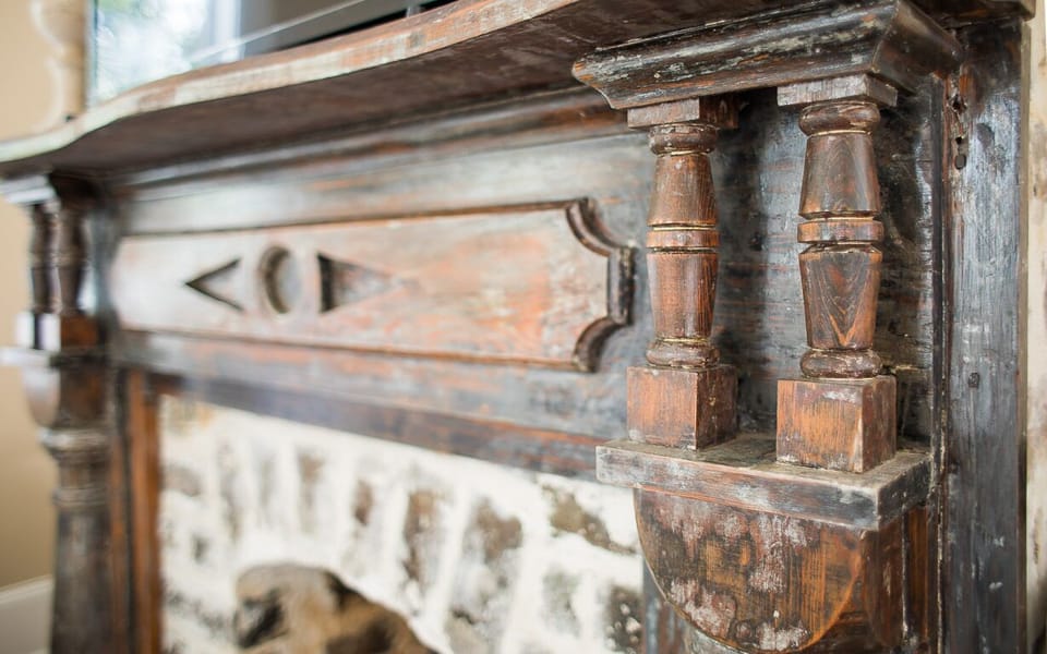The antique fireplace mantel is a true treasure.