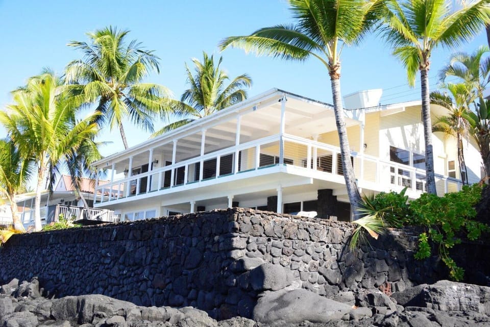 View of the house standing on the ocean shore 