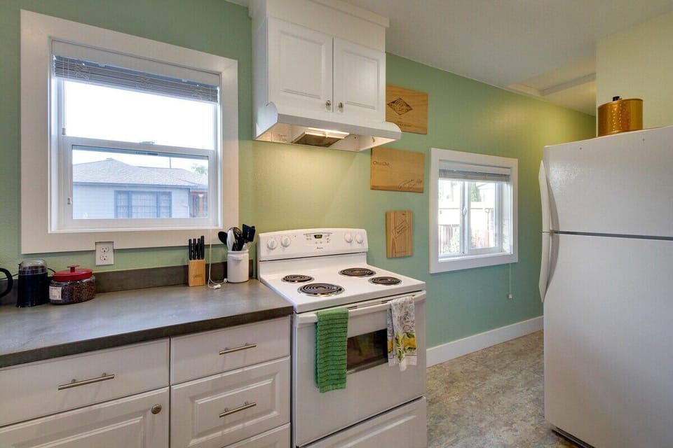 Kitchen and hall way that leads to the washer and dryer for your convenience!