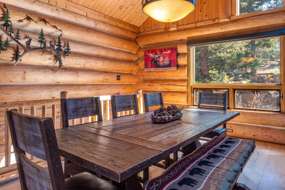 Dining table comfortably seats 8 in addition to 3 adjacent bar stools. 