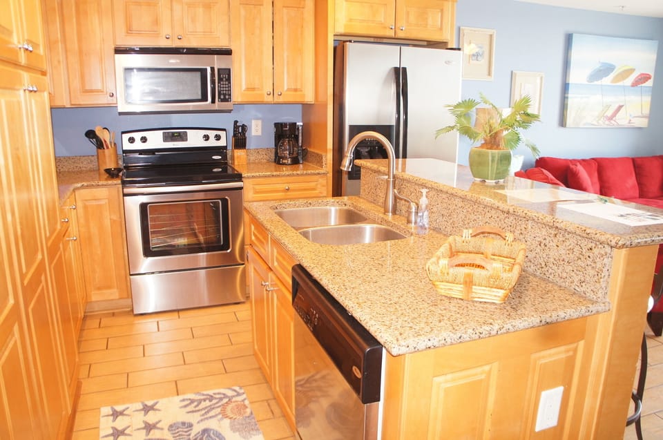 Fully furnished kitchen with stainless appliances and granite countertops!