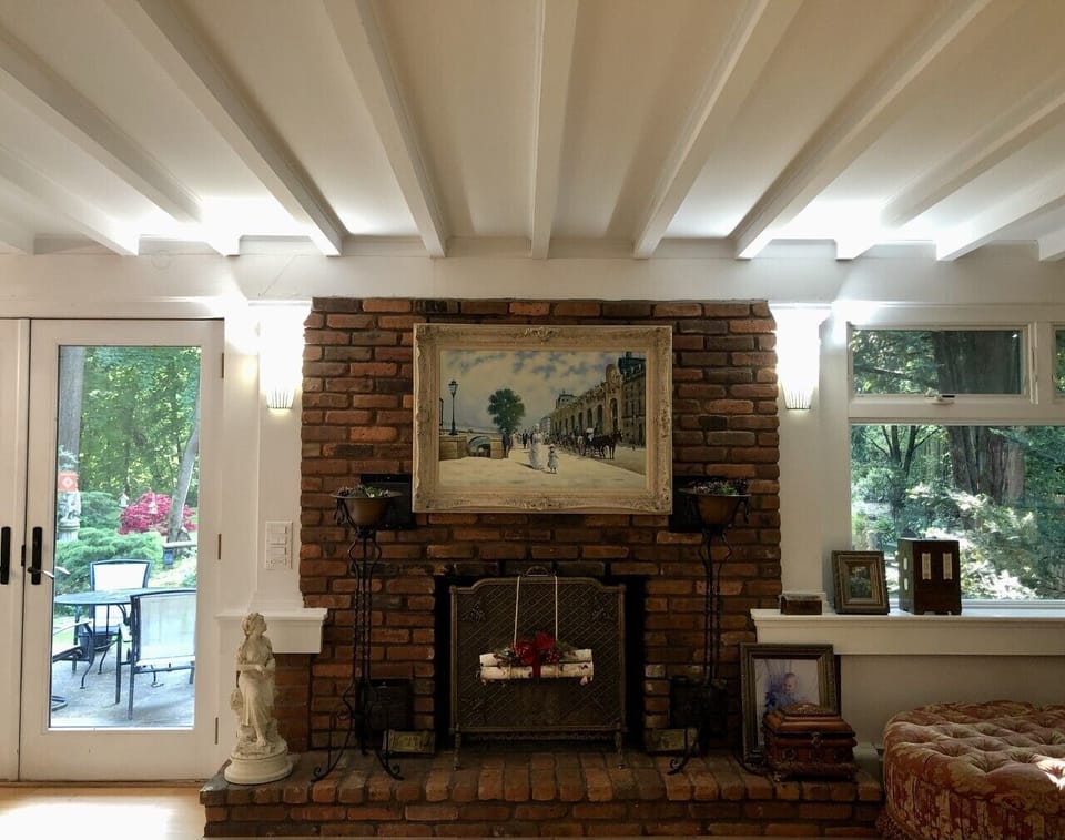 Original brick fireplace and beams