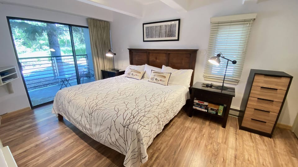 Bedroom with King bed and walk out patio