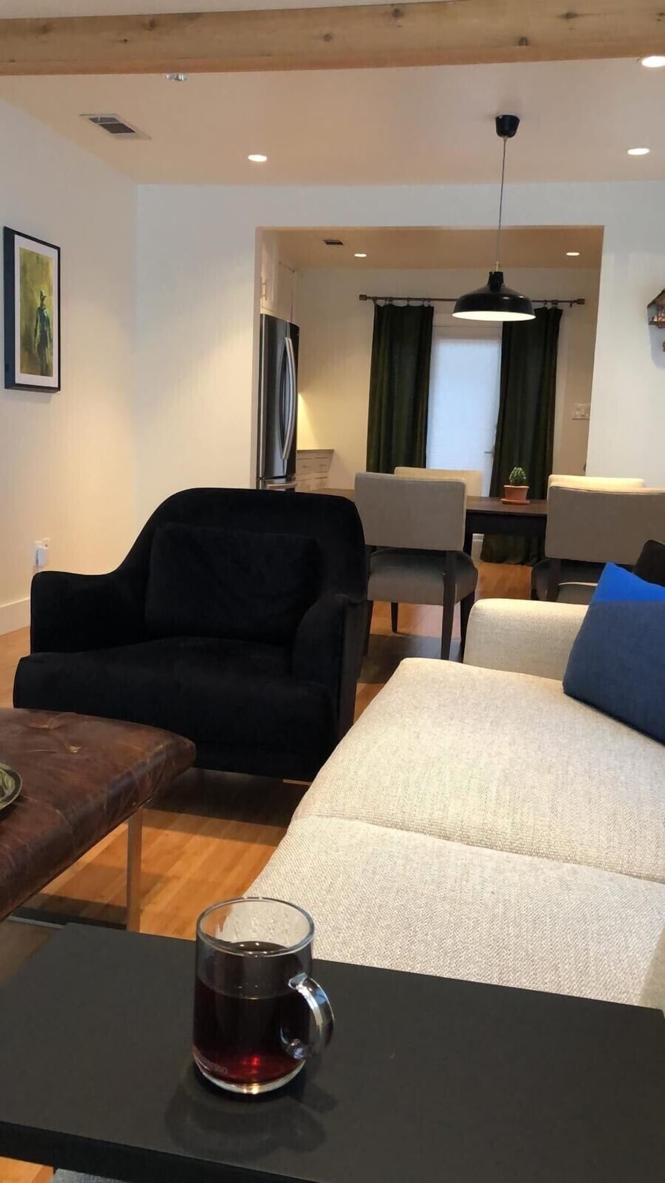 Kitchen opens up to dining and living. Oversized sofa is great for lounging. 