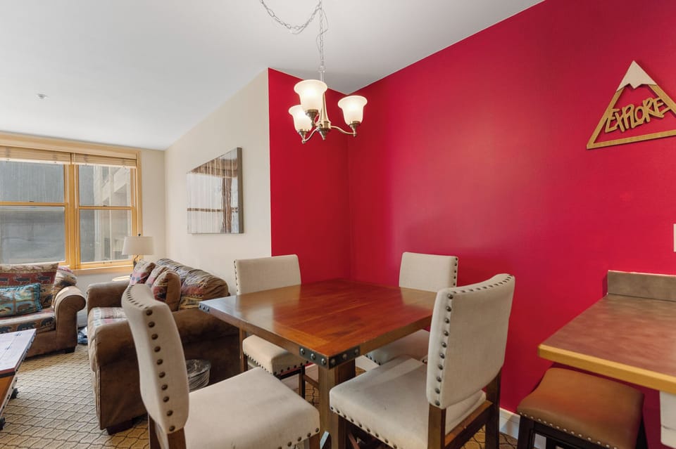 The dining area seats up to 4 with one additional seat at the breakfast bar.