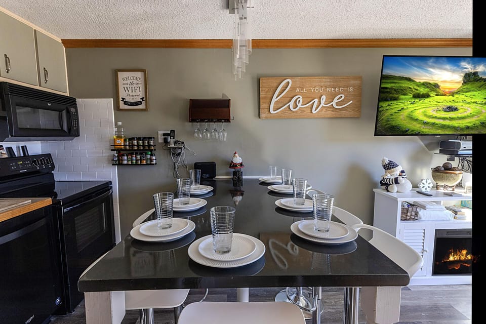 The kitchen island, with seating for eight people, is a great place to gather with your group for meals!