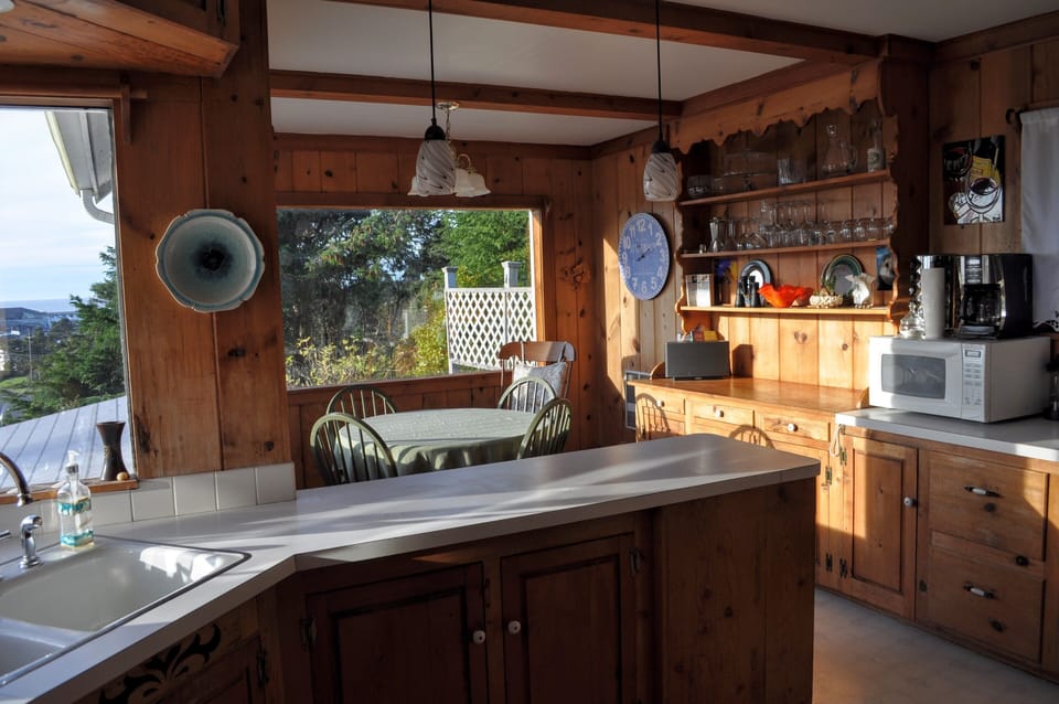 Kitchen and Breakfast nook. Windows overlook ocean. Very warm in the afternoon.