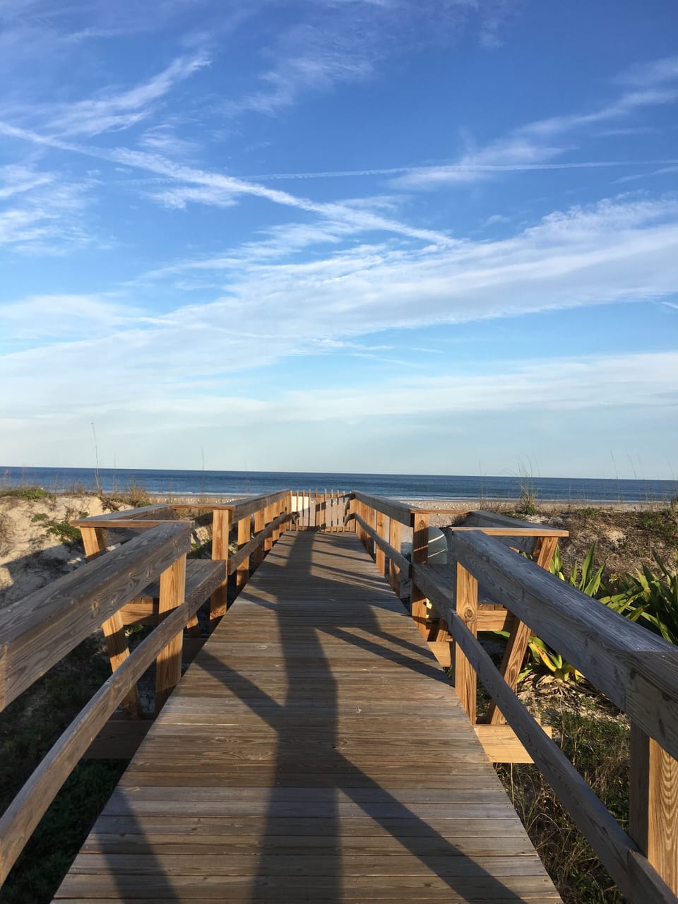 Boardwalk view of ocean and beach by Pool and Gazebo