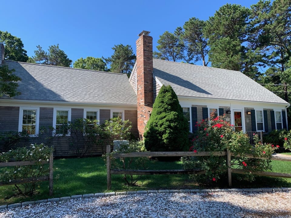 A large family room, dining room and screened porch to the left.