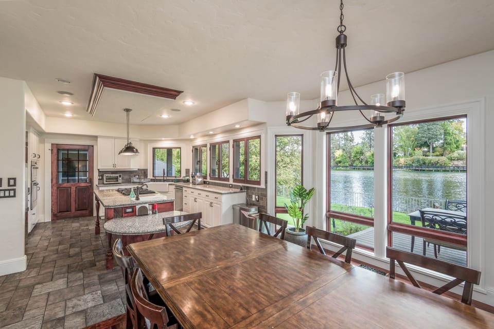 Open living, dining, kitchen all overlooking Mirror Pond, Drake Park, Old Bend