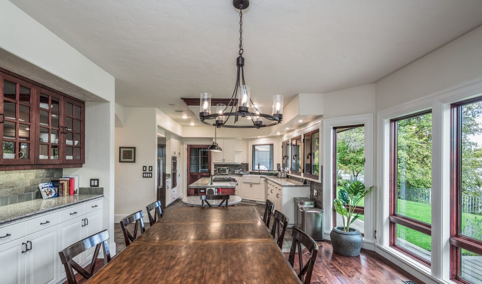 Open kitchen, dining, living with views of Mirror Pond, Drake Park, Old Bend.