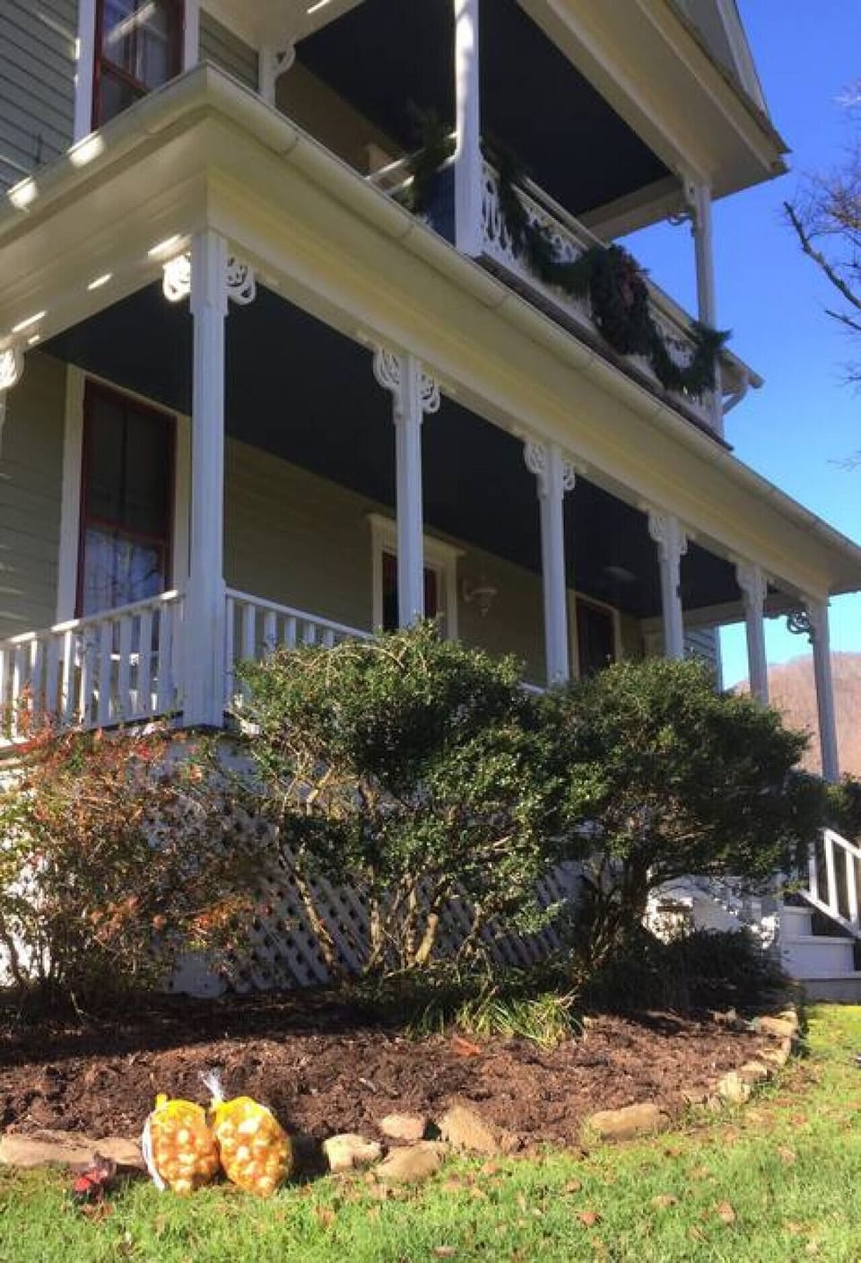 These double porches face east for a beautiful sunrise with a steaming cup of coffee.
