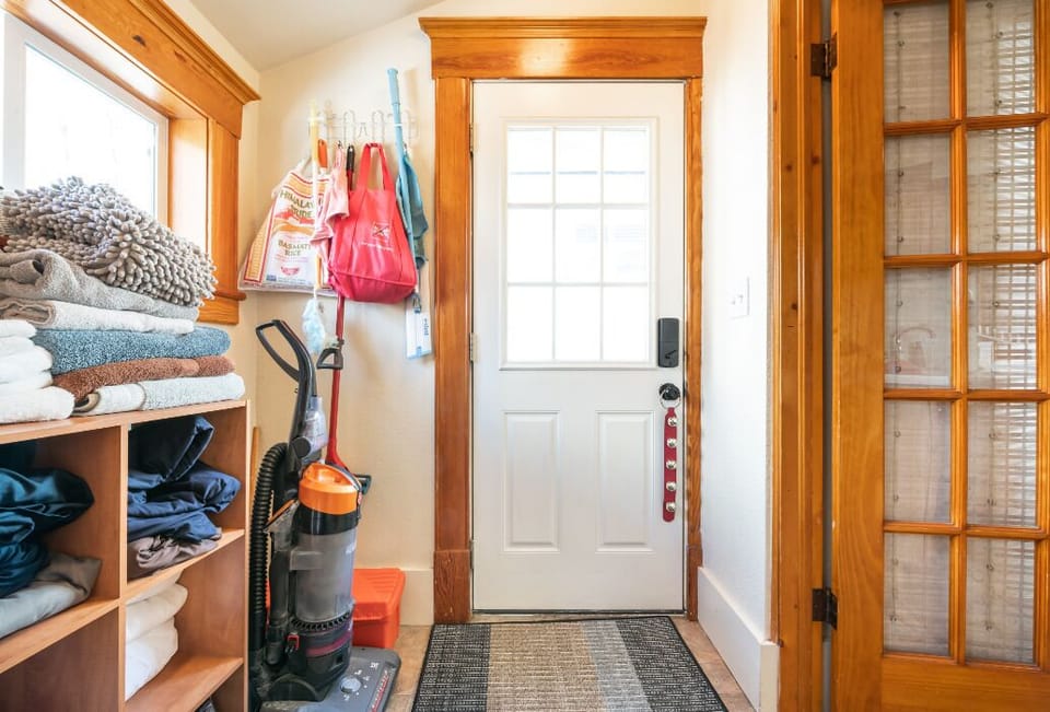 Shared laundry room with separate entrances/exits and locking doors. 