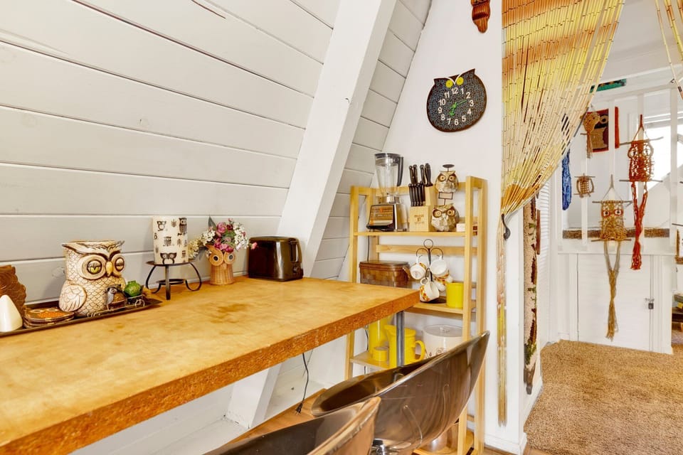Fully equipped cabin kitchen with ample cabinetry, stove, fridge, microwave, and coffee maker—perfect for cooking meals, morning coffee, and feeling right at home on your stay.
