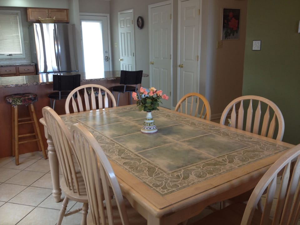 Dining Room sits 6 at table and 3 at the kitchen island