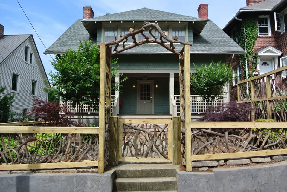 Front View of The Cozy Cottage with Mountain Laurel Fence