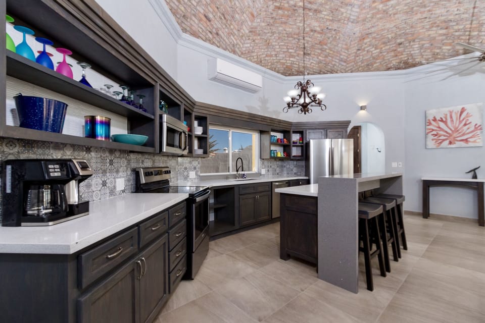 The kitchen has huge refrigerator for larger groups or longer stays.