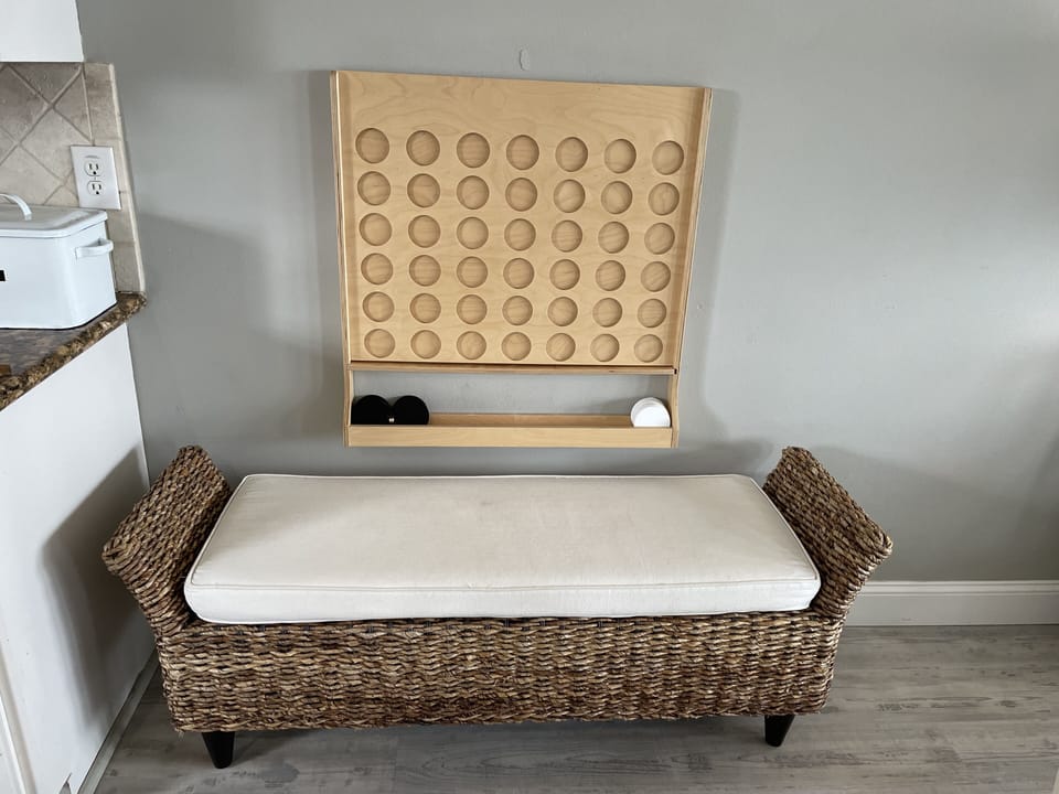 wall mounted Connect 4 with sitting bench