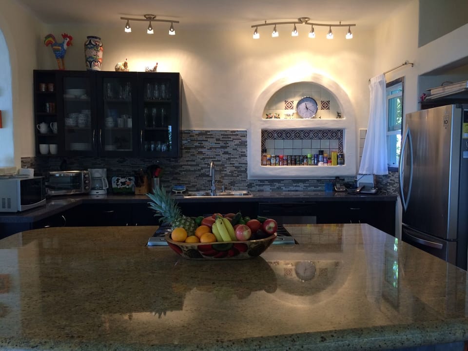 Kitchen featuring large center island with seating