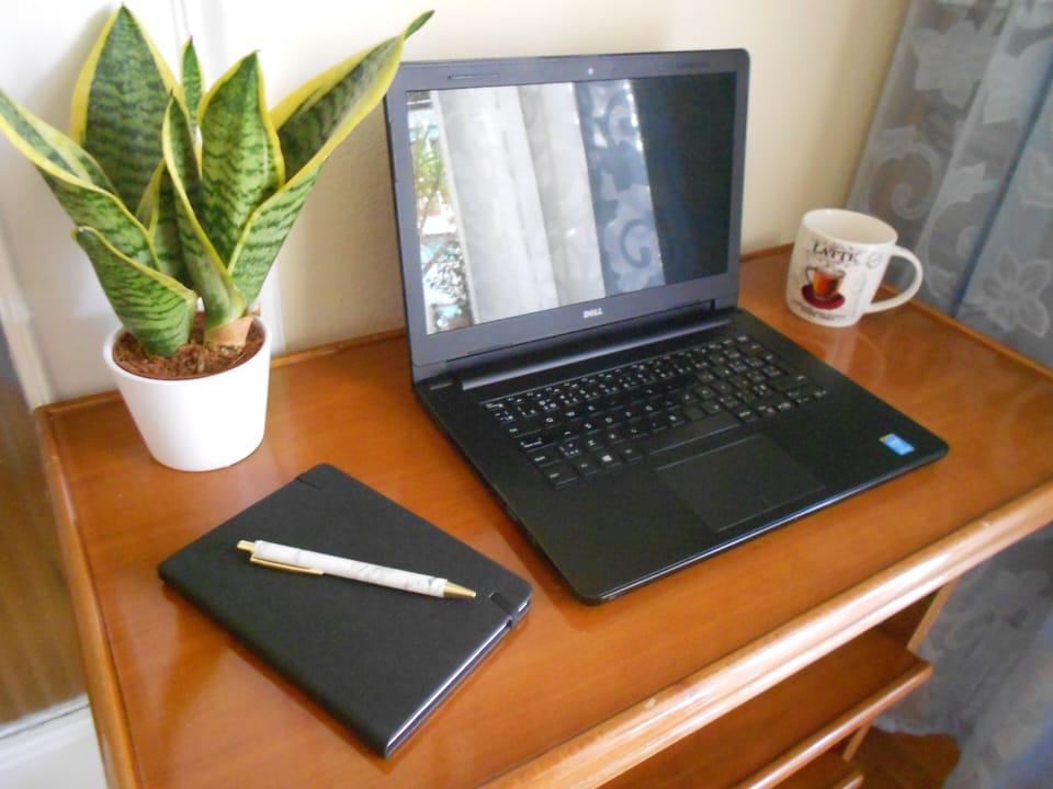 Workstation corner in living room. Just bring your laptop or tablet! 