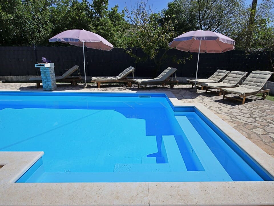 Water, Umbrella, Swimming Pool, Building, Plant, Azure, Shade, Outdoor Furniture, Rectangle, Sky