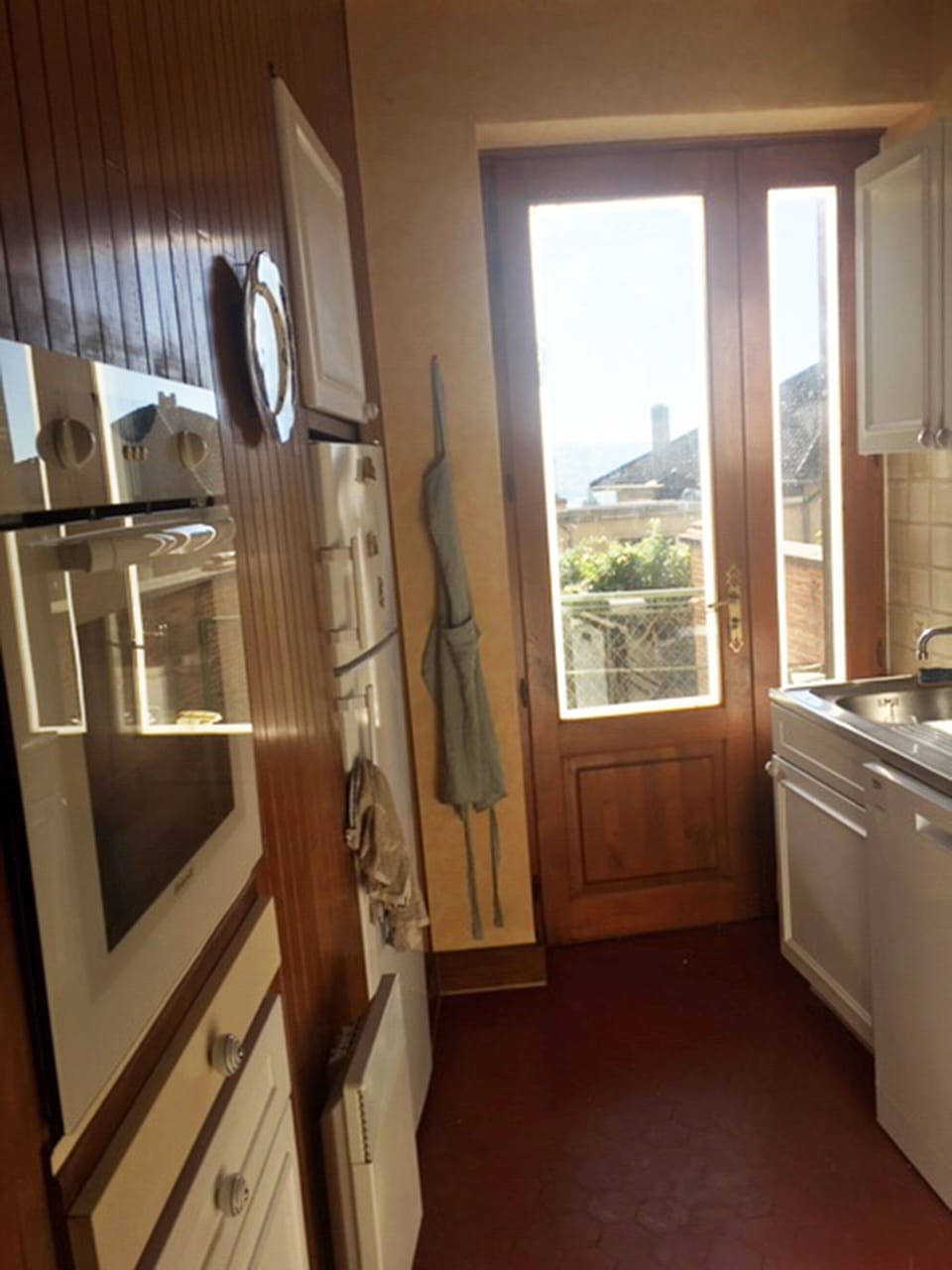 Kitchen with door out to terrace.